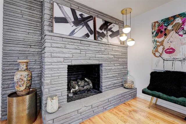 interior space with wood-type flooring and a fireplace