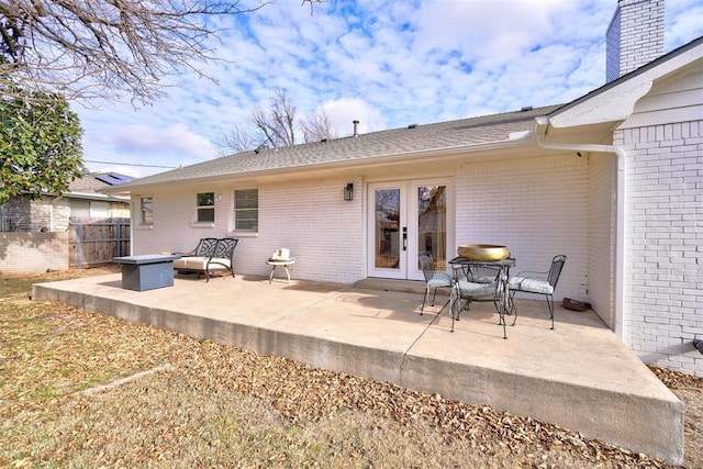 back of house with a patio and french doors