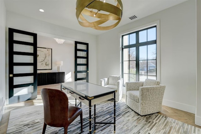 office featuring parquet floors and a healthy amount of sunlight