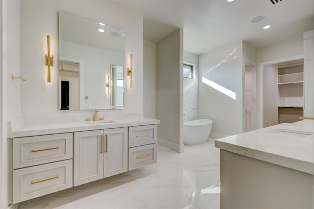 bathroom featuring vanity and a bathtub