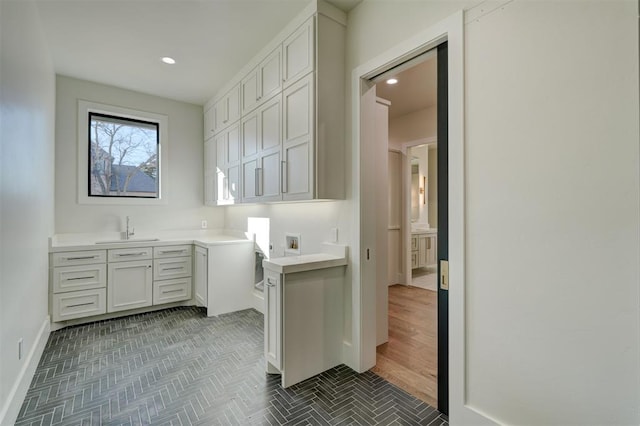 kitchen with sink and white cabinets