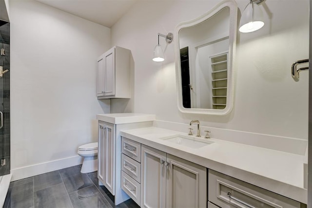 bathroom featuring walk in shower, vanity, and toilet