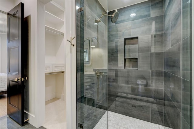 bathroom featuring a shower with door