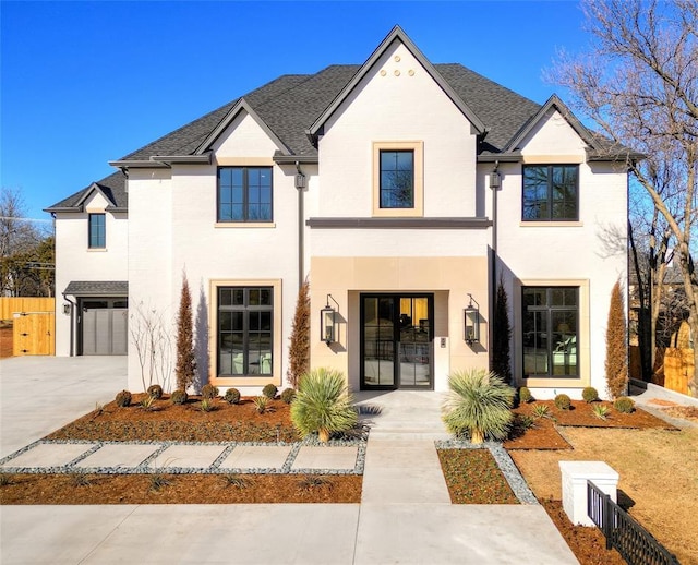 french country home with a garage