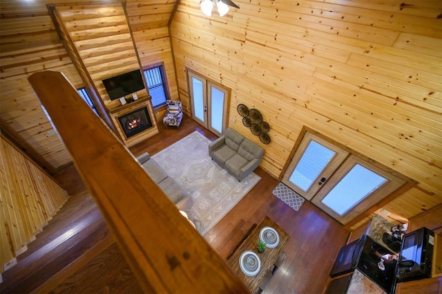 living room featuring hardwood / wood-style flooring and a high ceiling