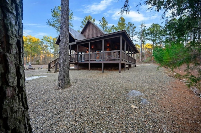 back of property with a wooden deck