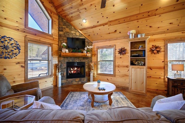 living room featuring wooden walls, wooden ceiling, and a healthy amount of sunlight