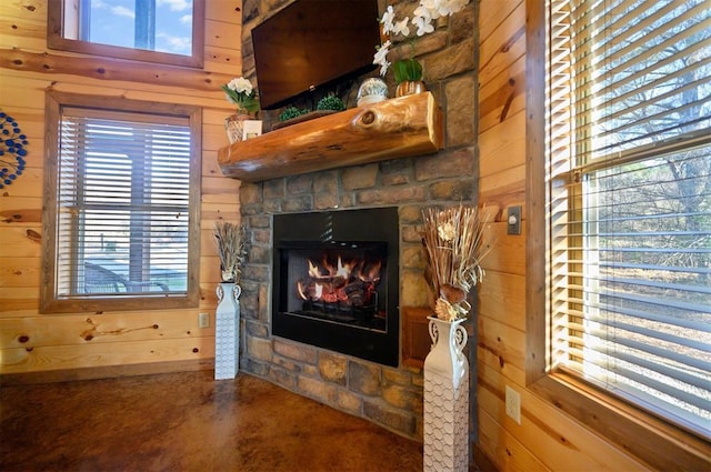 details featuring a fireplace and wood walls