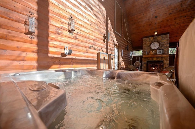 interior details featuring log walls, a fireplace, and wood walls