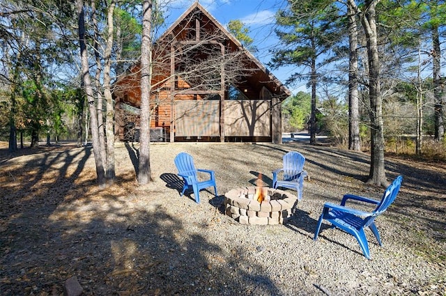 view of playground featuring an outdoor fire pit