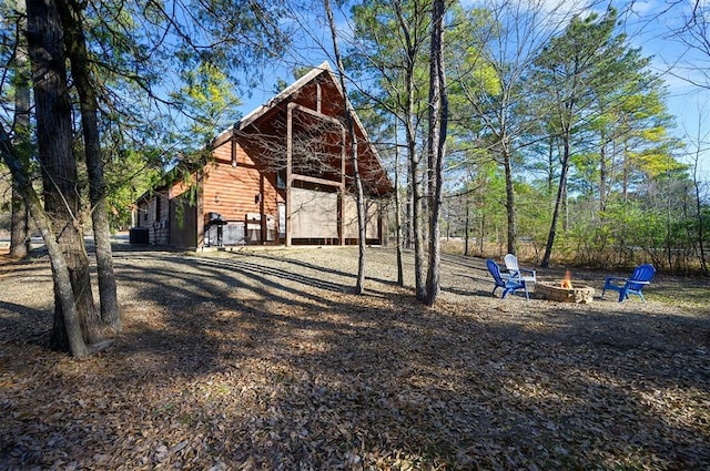 view of yard with an outdoor fire pit