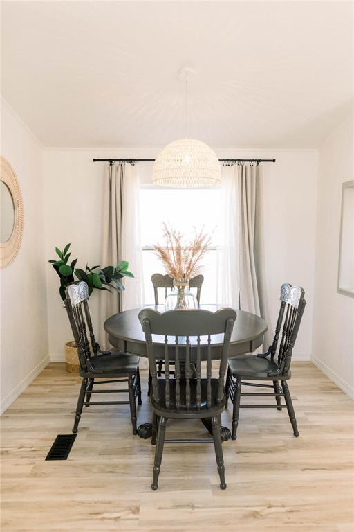 dining area featuring plenty of natural light and light wood-type flooring