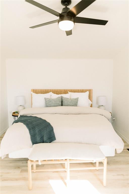 bedroom featuring hardwood / wood-style flooring and ceiling fan