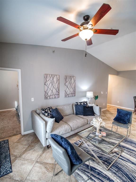 tiled living room featuring ceiling fan and lofted ceiling