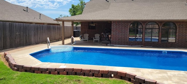 view of swimming pool with a patio area