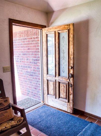 entryway featuring dark tile patterned floors