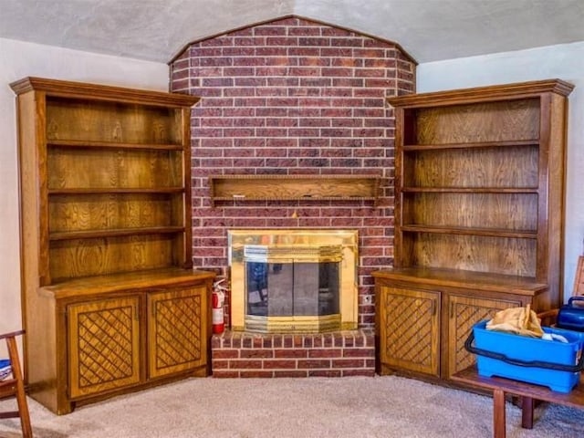 living room with a brick fireplace, light colored carpet, and lofted ceiling