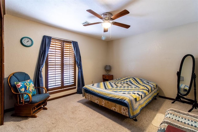 bedroom with visible vents, baseboards, carpet, and ceiling fan