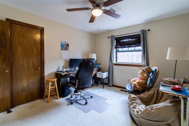 home office featuring baseboards, carpet floors, and a ceiling fan