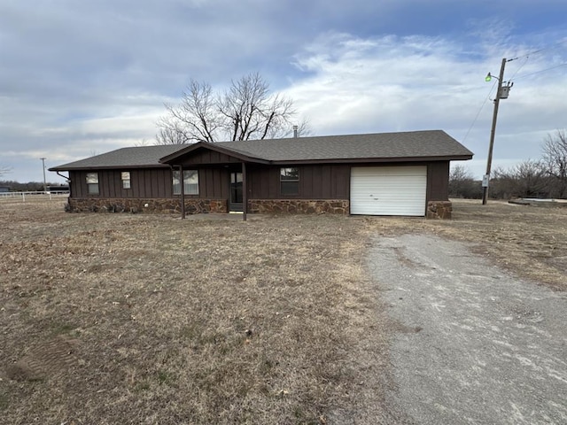 ranch-style house featuring a garage