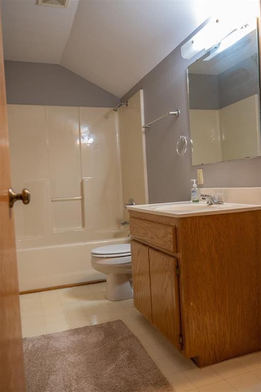 full bathroom with visible vents, toilet, lofted ceiling, bathing tub / shower combination, and vanity