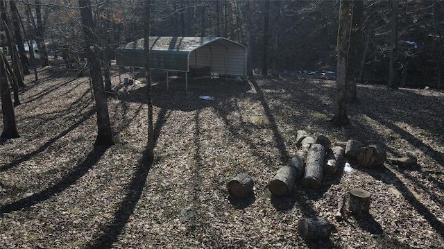 details featuring a view of trees and driveway