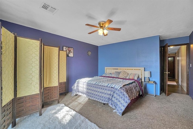 bedroom with light colored carpet and ceiling fan