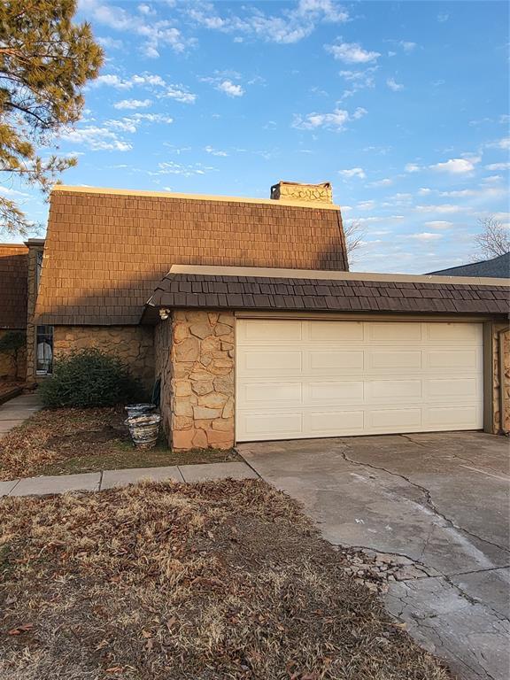 view of property exterior with a garage