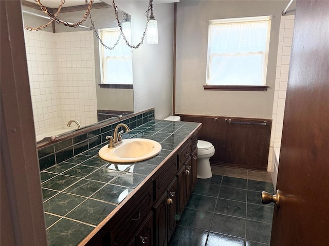 full bathroom with vanity, tile patterned floors, toilet, and shower / tub combination