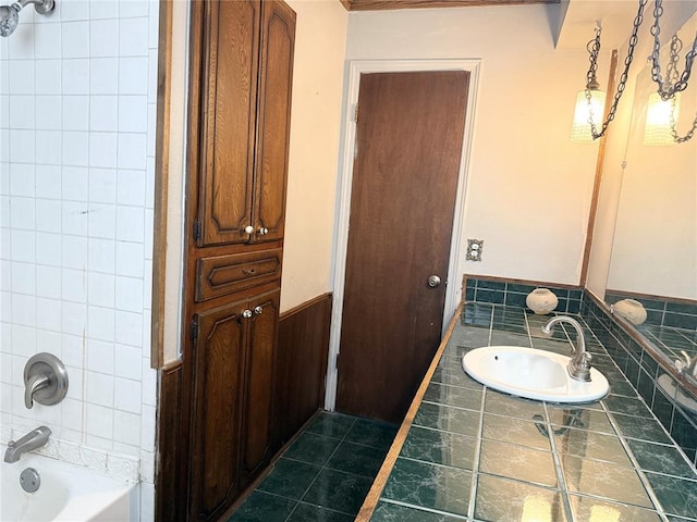 full bathroom featuring a sink, shower / tub combination, and tile patterned floors