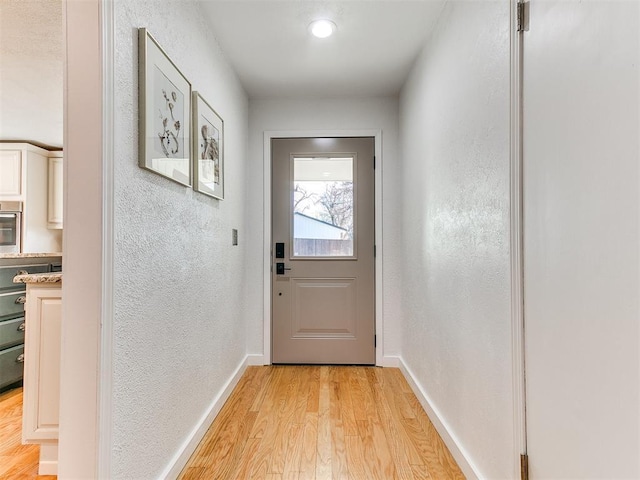 doorway with light hardwood / wood-style floors