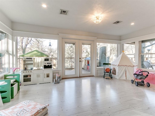 sunroom / solarium with french doors