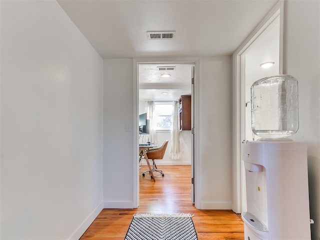 hall with light hardwood / wood-style flooring