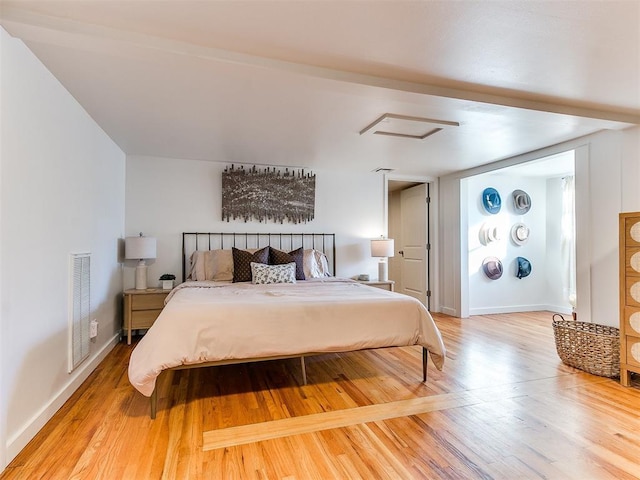 bedroom with hardwood / wood-style floors