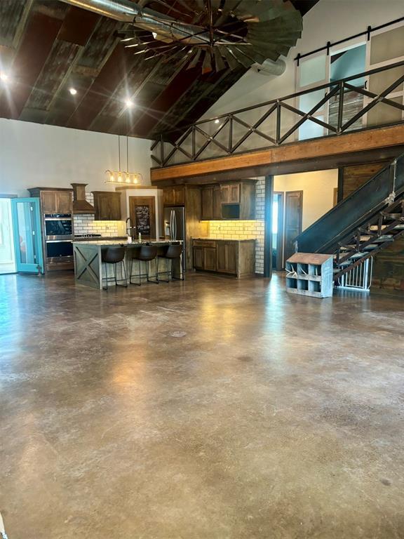 garage with stainless steel fridge