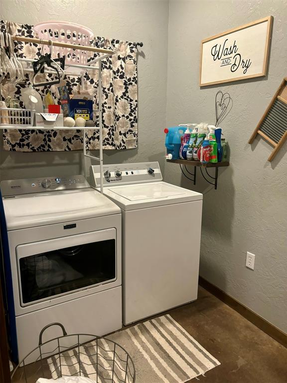 laundry room with independent washer and dryer