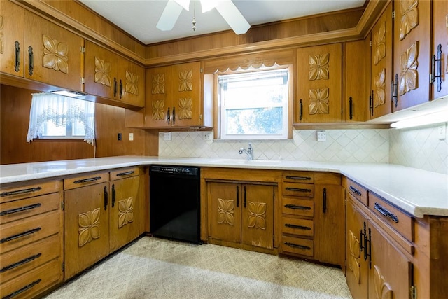 kitchen with tasteful backsplash, ceiling fan, black dishwasher, and sink