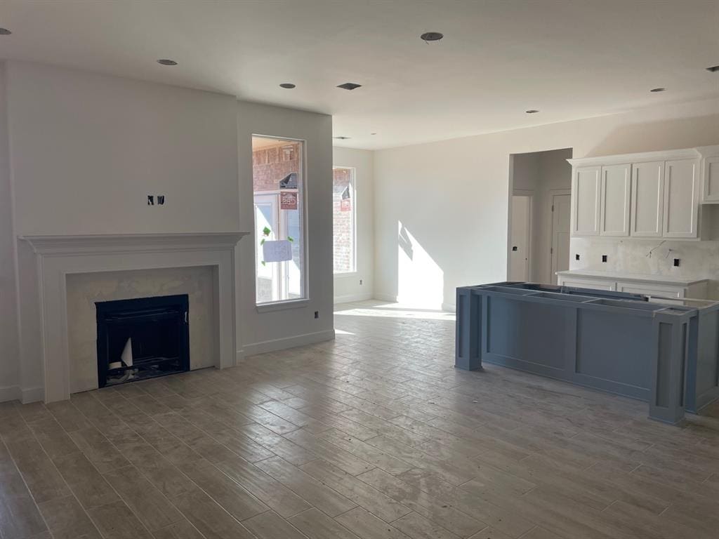 unfurnished living room featuring hardwood / wood-style floors