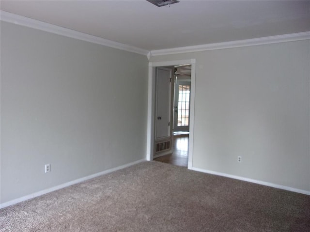 unfurnished room with crown molding and carpet flooring