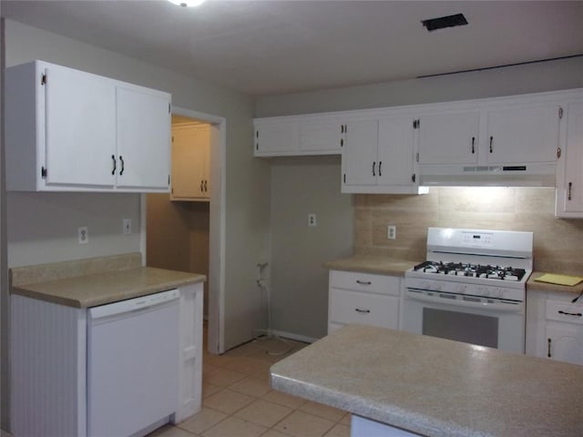 kitchen with backsplash, white appliances, light tile patterned floors, and white cabinets