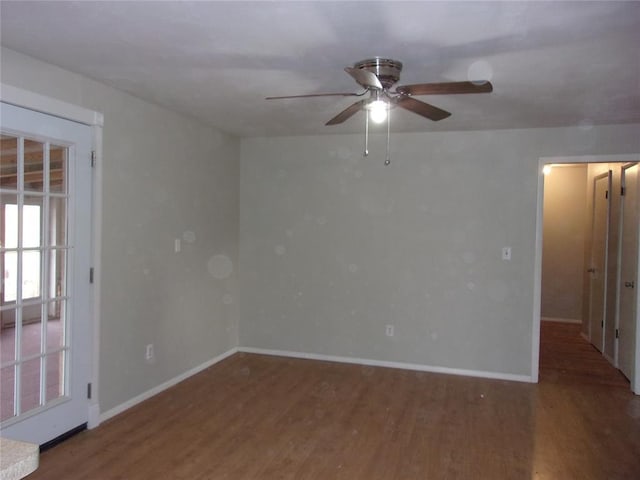 spare room with hardwood / wood-style flooring and ceiling fan