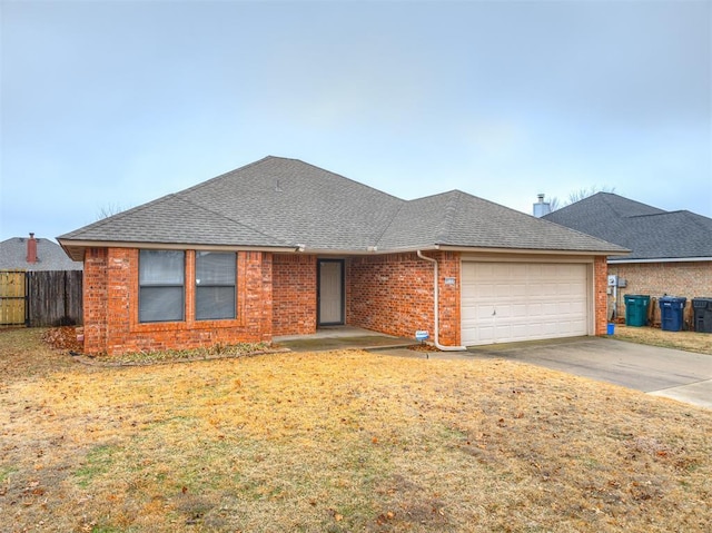 view of front of house with a garage and a front lawn