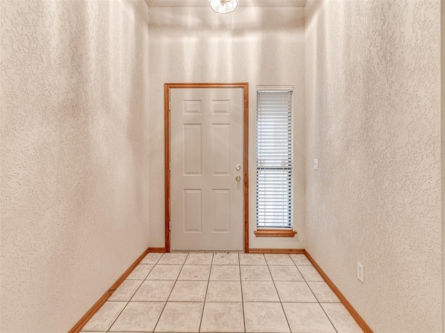 doorway featuring light tile patterned floors