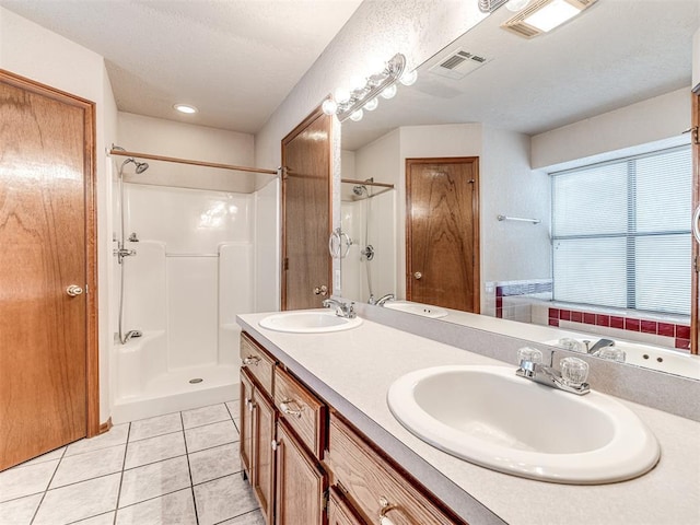 bathroom with tile patterned flooring, a shower, and vanity