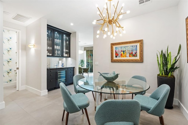 dining area with wine cooler, a chandelier, and indoor bar