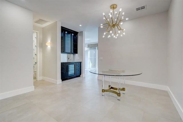 unfurnished dining area with a chandelier