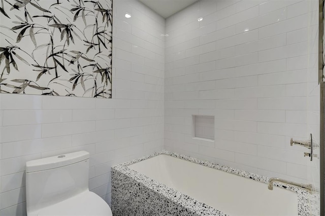 bathroom with toilet and tile walls