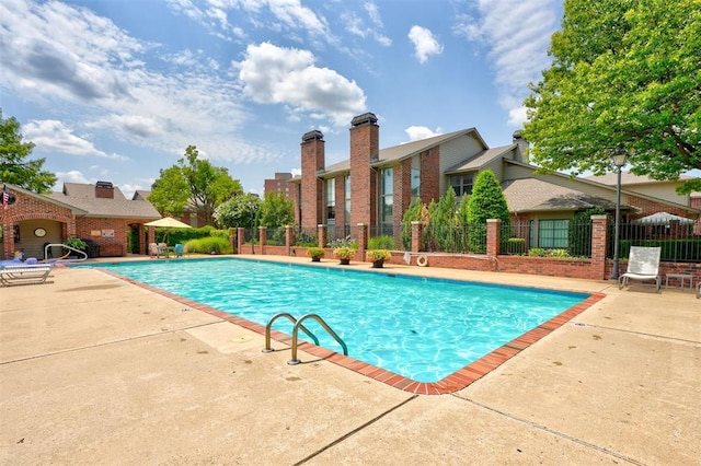 view of swimming pool with a patio