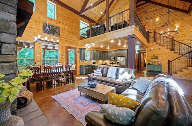 living room with beam ceiling, a chandelier, and high vaulted ceiling