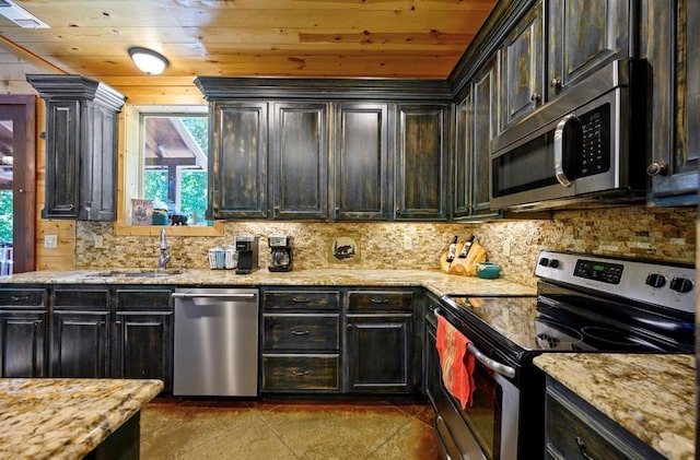 kitchen featuring sink, wood ceiling, light stone countertops, and appliances with stainless steel finishes